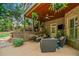 Inviting covered patio with comfortable seating, a ceiling fan, and a mounted TV for outdoor relaxation and entertainment at 106 Stephens Farm Dr, Canton, GA 30115
