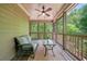 Relaxing screened-in porch with comfortable seating and views of the surrounding greenery at 106 Stephens Farm Dr, Canton, GA 30115