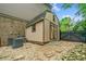 Exterior shed with neutral siding and dark trim features a side access door and is surrounded by stone at 106 Stephens Farm Dr, Canton, GA 30115