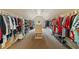 Extensive walk-in closet with built-in shelving and hanging space for organized storage at 106 Stephens Farm Dr, Canton, GA 30115