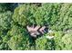 An aerial shot of the home nestled among mature trees at 5105 Jett Forest Trl, Atlanta, GA 30327