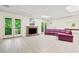 Large basement space with a fireplace, glass doors to the outside, and tiled flooring at 5105 Jett Forest Trl, Atlanta, GA 30327