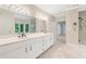 Elegant bathroom features a double vanity, large mirrors, and a tiled shower for spa-like experience at 5105 Jett Forest Trl, Atlanta, GA 30327
