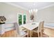 Formal dining room featuring a chandelier and classic decor, great for entertaining at 5105 Jett Forest Trl, Atlanta, GA 30327