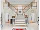 Elegant foyer showcasing a grand staircase and marble flooring at 5105 Jett Forest Trl, Atlanta, GA 30327