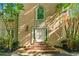 Inviting front entrance with brick steps and decorative planters flanking the doorway at 5105 Jett Forest Trl, Atlanta, GA 30327