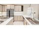 Bright kitchen features stainless steel refrigerator, white cabinets, and a stainless steel sink at 5105 Jett Forest Trl, Atlanta, GA 30327