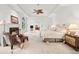 Spacious main bedroom with a tray ceiling, fireplace, and sitting area at 5105 Jett Forest Trl, Atlanta, GA 30327