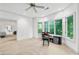 Spacious home office with carpet, large windows, and access to another room at 5105 Jett Forest Trl, Atlanta, GA 30327