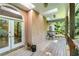 Covered porch with a wood floor, skylights, and tree views at 5105 Jett Forest Trl, Atlanta, GA 30327