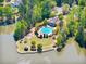 Aerial view of lakefront community pool and clubhouse surrounded by lush trees at 1435 Harburn Ct, Cumming, GA 30041