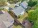 Aerial view of brick home with a pergola in a landscaped backyard at 1435 Harburn Ct, Cumming, GA 30041