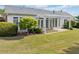 Spacious backyard featuring a pergola covered patio, lush lawn, and mature trees at 1435 Harburn Ct, Cumming, GA 30041