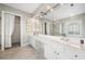 Bright bathroom features a double vanity, ample counter space and decorative window for a relaxing atmosphere at 1435 Harburn Ct, Cumming, GA 30041