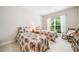 Charming bedroom with two twin beds, floral bedding, and a window allowing natural light at 1435 Harburn Ct, Cumming, GA 30041