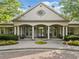 Community clubhouse with large windows, columns, and manicured landscaping at 1435 Harburn Ct, Cumming, GA 30041