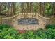 Stone sign for Long Lake community surrounded by lush landscaping at 1435 Harburn Ct, Cumming, GA 30041