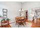 Cozy dining area with hardwood floors, a chandelier, and seamless transition to the kitchen space at 1435 Harburn Ct, Cumming, GA 30041