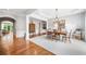Elegant dining room with hardwood floors and sophisticated chandelier lighting at 1435 Harburn Ct, Cumming, GA 30041