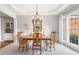Elegant dining room featuring a tray ceiling and decorative chandelier at 1435 Harburn Ct, Cumming, GA 30041