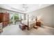 Spacious main bedroom with ample natural light, a decorative ceiling fan, and plenty of room for furniture at 1435 Harburn Ct, Cumming, GA 30041