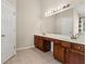 Bathroom featuring dual sinks, ample counter space, and stylish vanity at 2055 Hickory Station Cir, Snellville, GA 30078