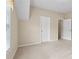 Large bedroom with a neutral color scheme, carpet, a window, and doors to the hallway and closet at 2055 Hickory Station Cir, Snellville, GA 30078
