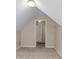 Neutral bedroom with an attic window, beige carpet, and walls at 2055 Hickory Station Cir, Snellville, GA 30078