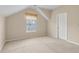 Slanted-ceiling bedroom with a window that provides natural light plus a standard door to the hallway at 2055 Hickory Station Cir, Snellville, GA 30078