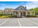 Community clubhouse with stone facade and ample parking at 2055 Hickory Station Cir, Snellville, GA 30078