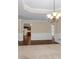 Open dining room with hardwood floors and view of kitchen through a doorway at 2055 Hickory Station Cir, Snellville, GA 30078