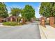Gated entrance to a residential community with brick pillars and lush landscaping at 2055 Hickory Station Cir, Snellville, GA 30078
