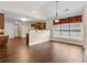 Eating area with hardwood floors, granite counters and view to the kitchen at 2055 Hickory Station Cir, Snellville, GA 30078
