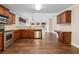 Open kitchen with stainless appliances, granite counters, hardwood floors and desk at 2055 Hickory Station Cir, Snellville, GA 30078