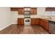 Kitchen with granite counters, hardwood floors and stainless steel appliances at 2055 Hickory Station Cir, Snellville, GA 30078