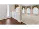 Inviting entry area with hardwood floors, wainscoting, and a view into the bright living room at 2055 Hickory Station Cir, Snellville, GA 30078