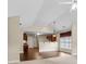 Open-concept living space with dark wood floors and a view into the kitchen at 2055 Hickory Station Cir, Snellville, GA 30078