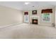 Bright living room with fireplace, neutral walls, and lots of natural light at 2055 Hickory Station Cir, Snellville, GA 30078