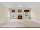 Large living room with carpet, fireplace, natural light, and vaulted ceiling at 2055 Hickory Station Cir, Snellville, GA 30078