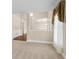 Elegant living room featuring decorative molding, neutral paint, and a large window with valances at 2055 Hickory Station Cir, Snellville, GA 30078