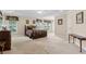 Spacious main bedroom with tray ceiling, natural light, and room for furnishings at 2055 Hickory Station Cir, Snellville, GA 30078