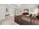 Spacious main bedroom with tray ceiling, natural light, and room for furnishings at 2055 Hickory Station Cir, Snellville, GA 30078