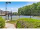 Community tennis court with fencing and landscaping at 2055 Hickory Station Cir, Snellville, GA 30078