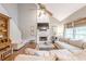 Warm and inviting living room with fireplace, vaulted ceiling, and plentiful seating at 4960 Cinnabar Dr, Alpharetta, GA 30022