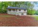 Charming two-story home featuring a cozy front porch and well-maintained landscaping at 607 Hickory Creek Ln, Woodstock, GA 30188