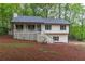 Charming two-story home featuring a cozy front porch and well-maintained landscaping at 607 Hickory Creek Ln, Woodstock, GA 30188