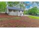 Charming two-story home featuring a cozy front porch and well-maintained landscaping at 607 Hickory Creek Ln, Woodstock, GA 30188