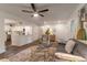 Open-concept living area with hardwood floors and stylish furnishings at 607 Hickory Creek Ln, Woodstock, GA 30188