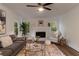 Bright living room with modern furniture, a decorative fireplace, and ample natural light at 607 Hickory Creek Ln, Woodstock, GA 30188