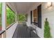 Inviting front porch with seating, perfect for relaxing and enjoying the view at 607 Hickory Creek Ln, Woodstock, GA 30188